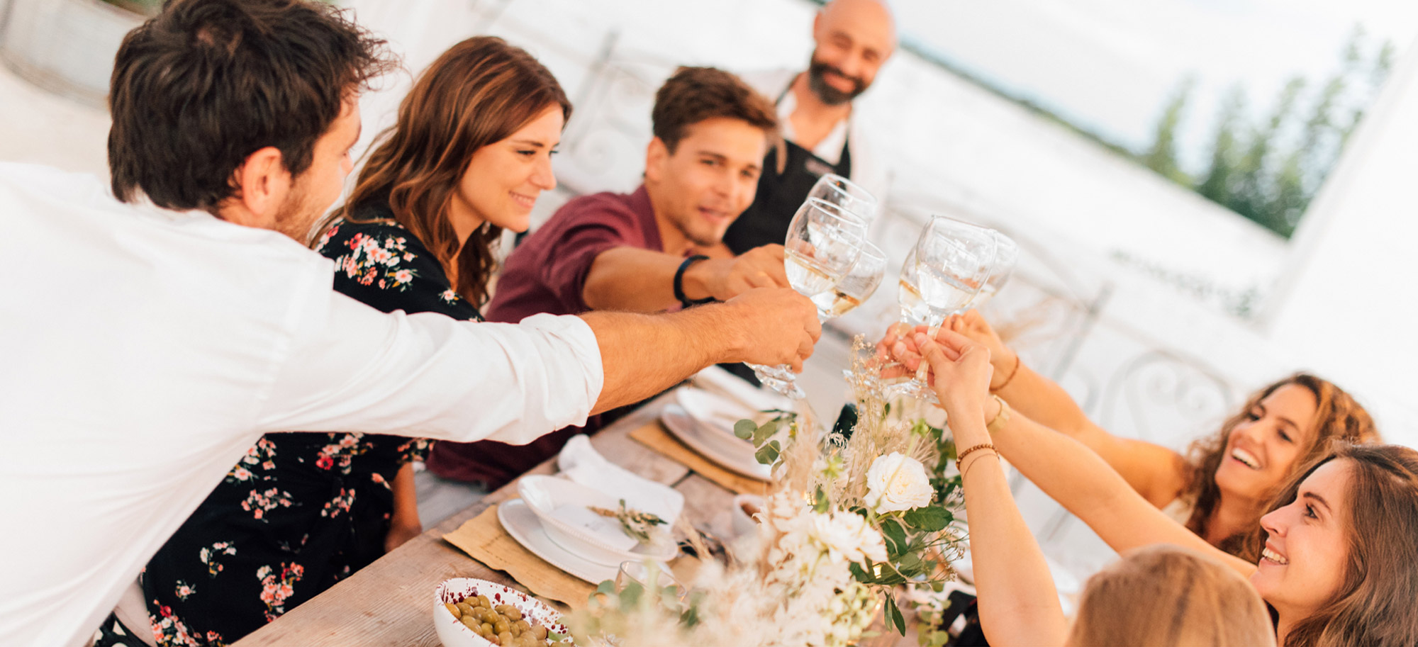 Family enjoys a meal with a private chef at home