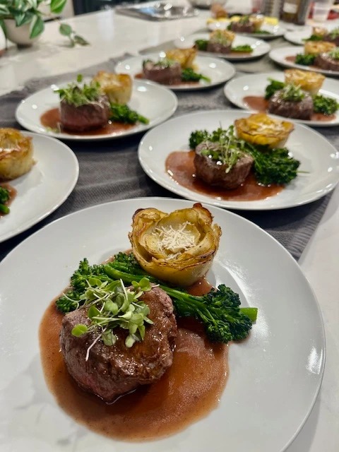 Mignon with red wine demi glace, scalloped potatoes, broccolini.jpg