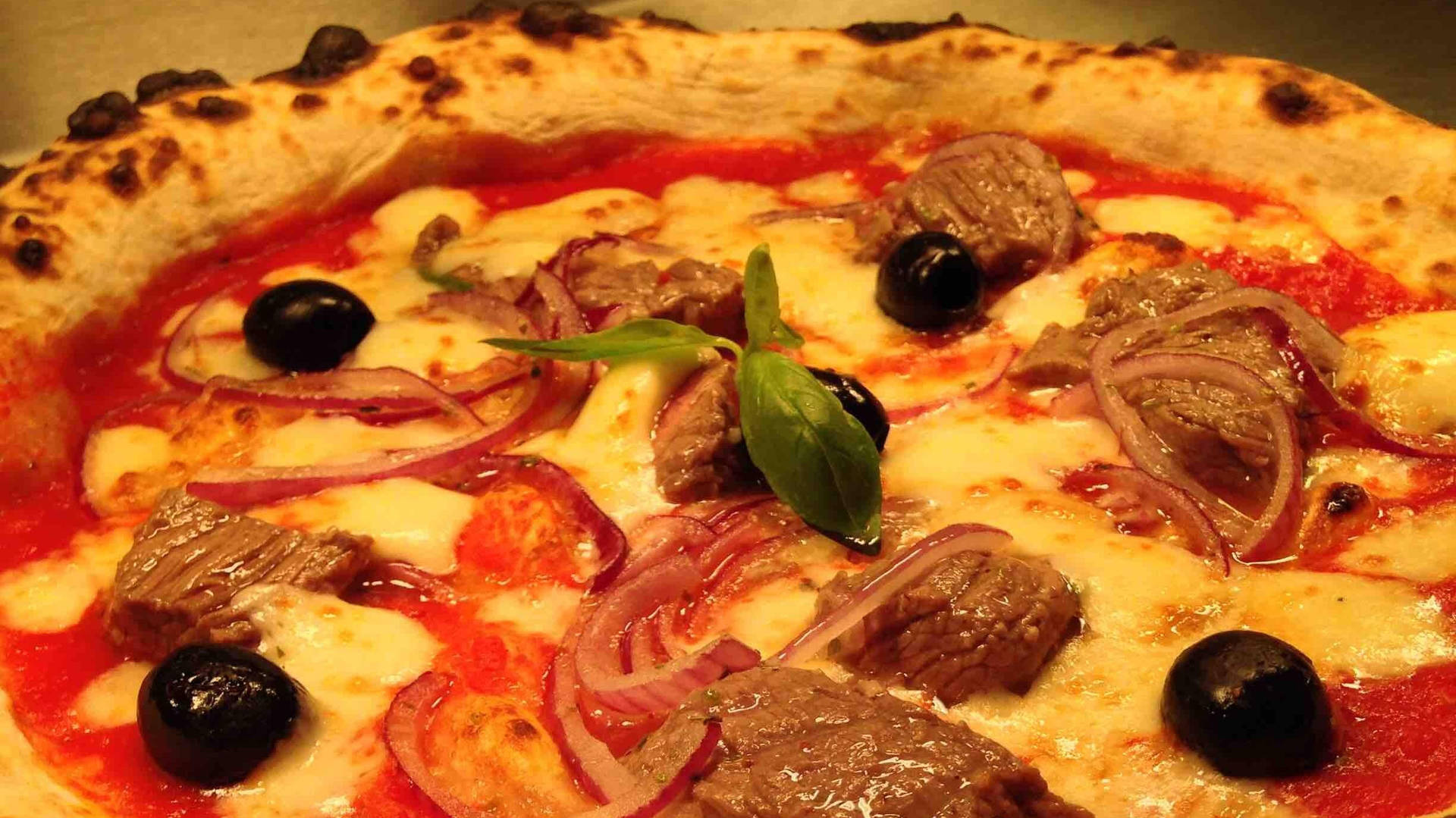 Marinated beef , marinated onion, black olives , garlic oil.jpeg