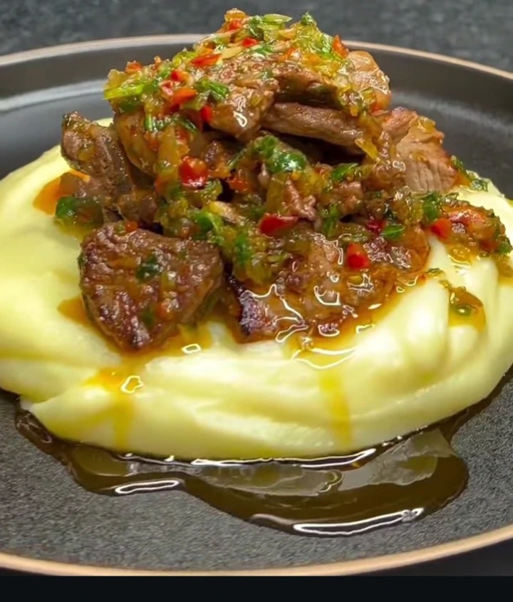 Creamy mashed potatoes with spicy beef sauce