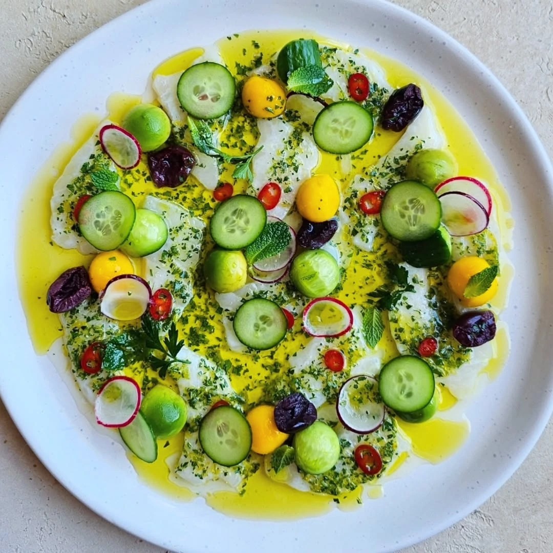 Halibut ceviche, mango, avo, cucumber, black olives, and lemon oil#fish #halibut #ceviche.heic.jpg