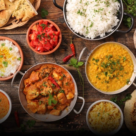 Authentic-Indian-meal-served-with-rice-curry-and-breads-573x573.jpg