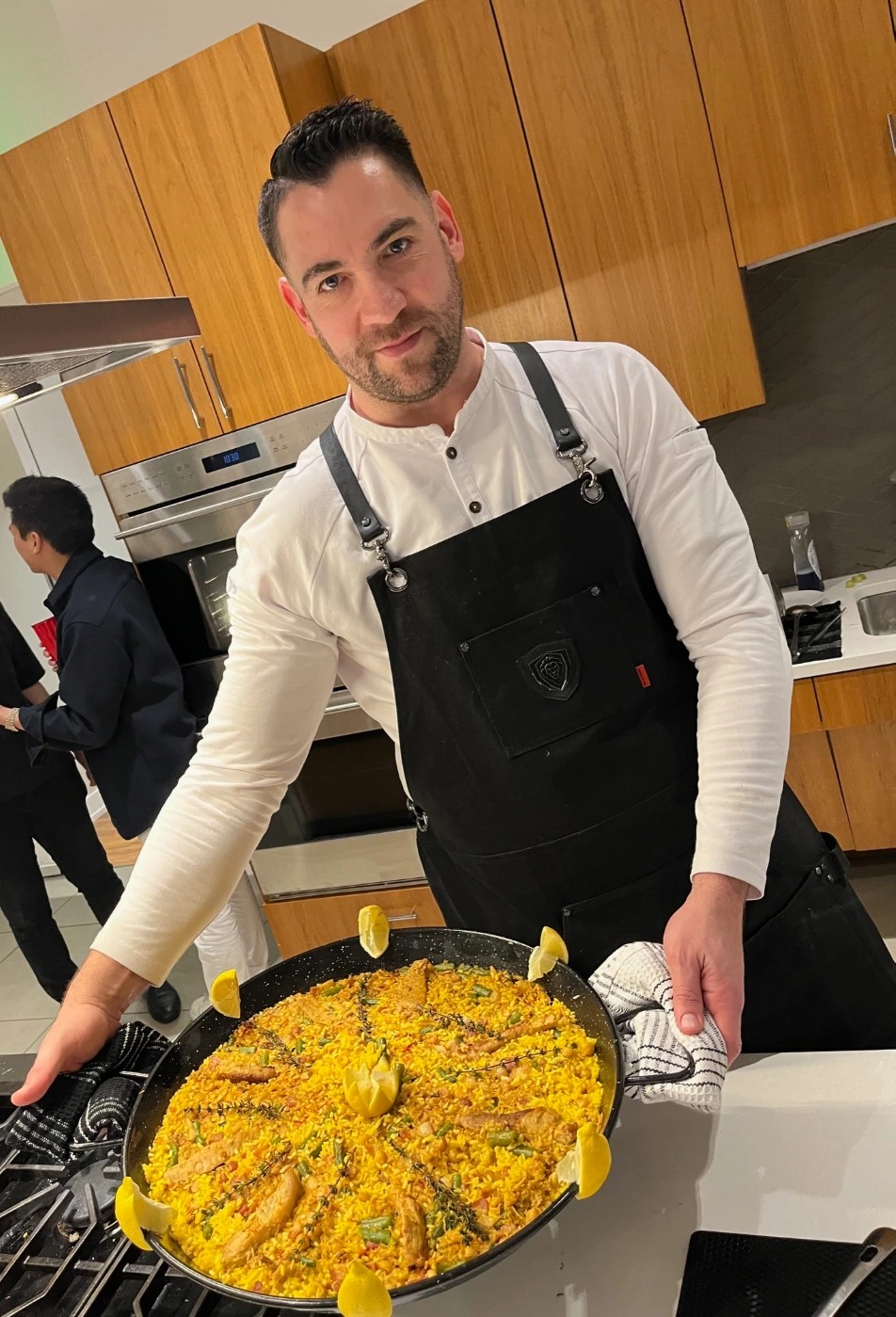 Mi serving paella.jpeg