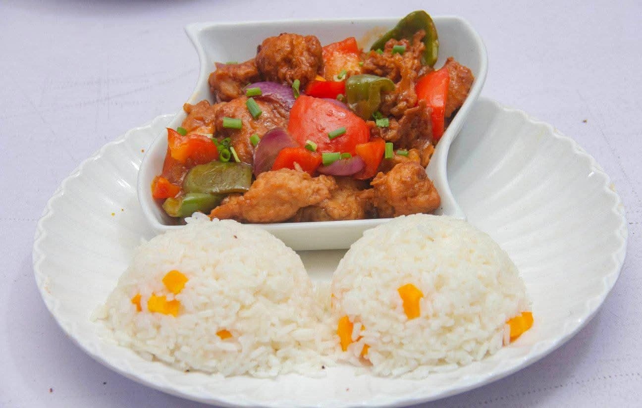 Sweet and sour sauce served with rice
