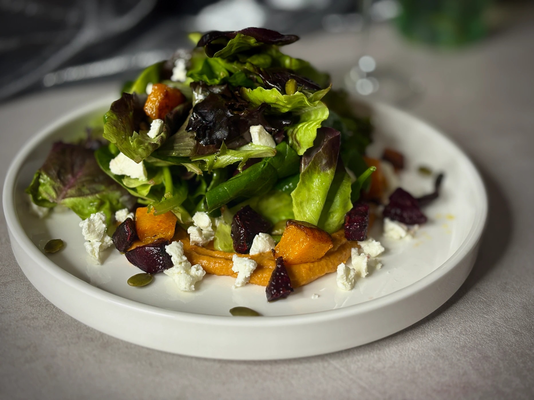Roasted Pumpkin and Beet Salad with Harissa Hummus, Goat Cheese, Pumpkin Seeds.png
