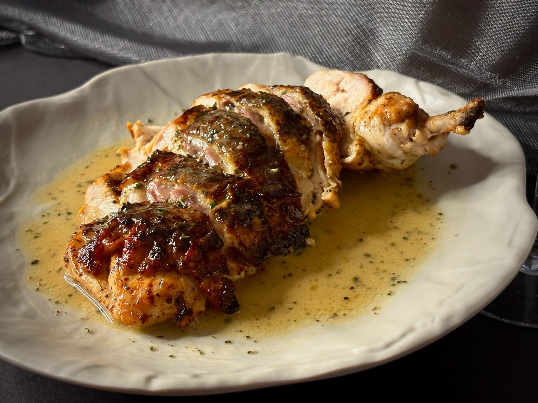 Pan Roasted Chicken Stuffed with Prosciutto and smoked mozzarella, rosemary buerre blanc.png