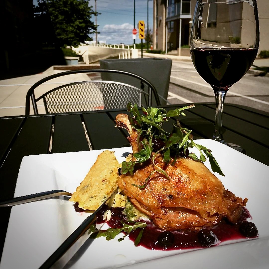 Pan Roasted Duck with Corn Spoonbread, Blueberry Reduction.png