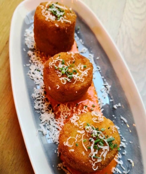 Arancinis with parmesan cheese, mortadella & piquillos.png