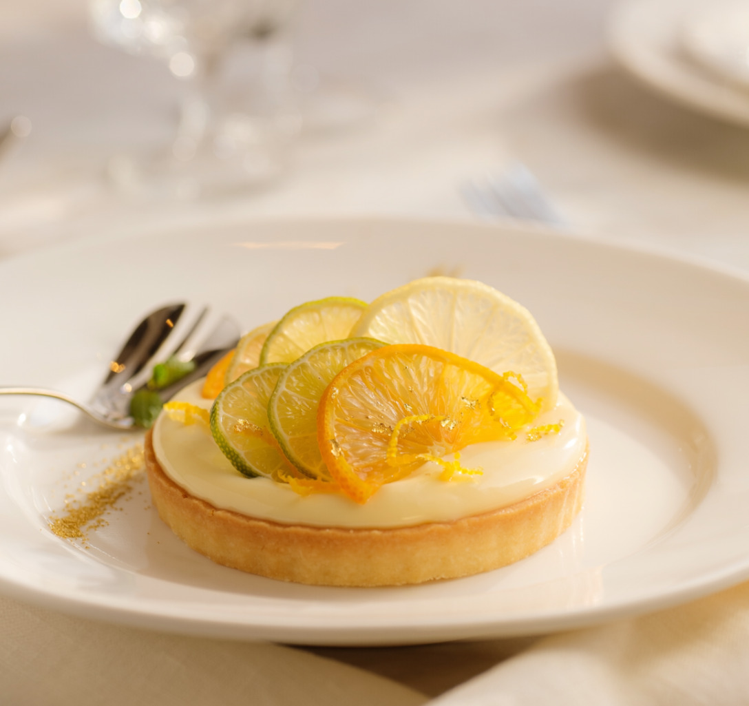 Firefly_Elegant thin citrus tart, smooth vanilla diplomat cream, candied citrus zest, gold du 196134.png