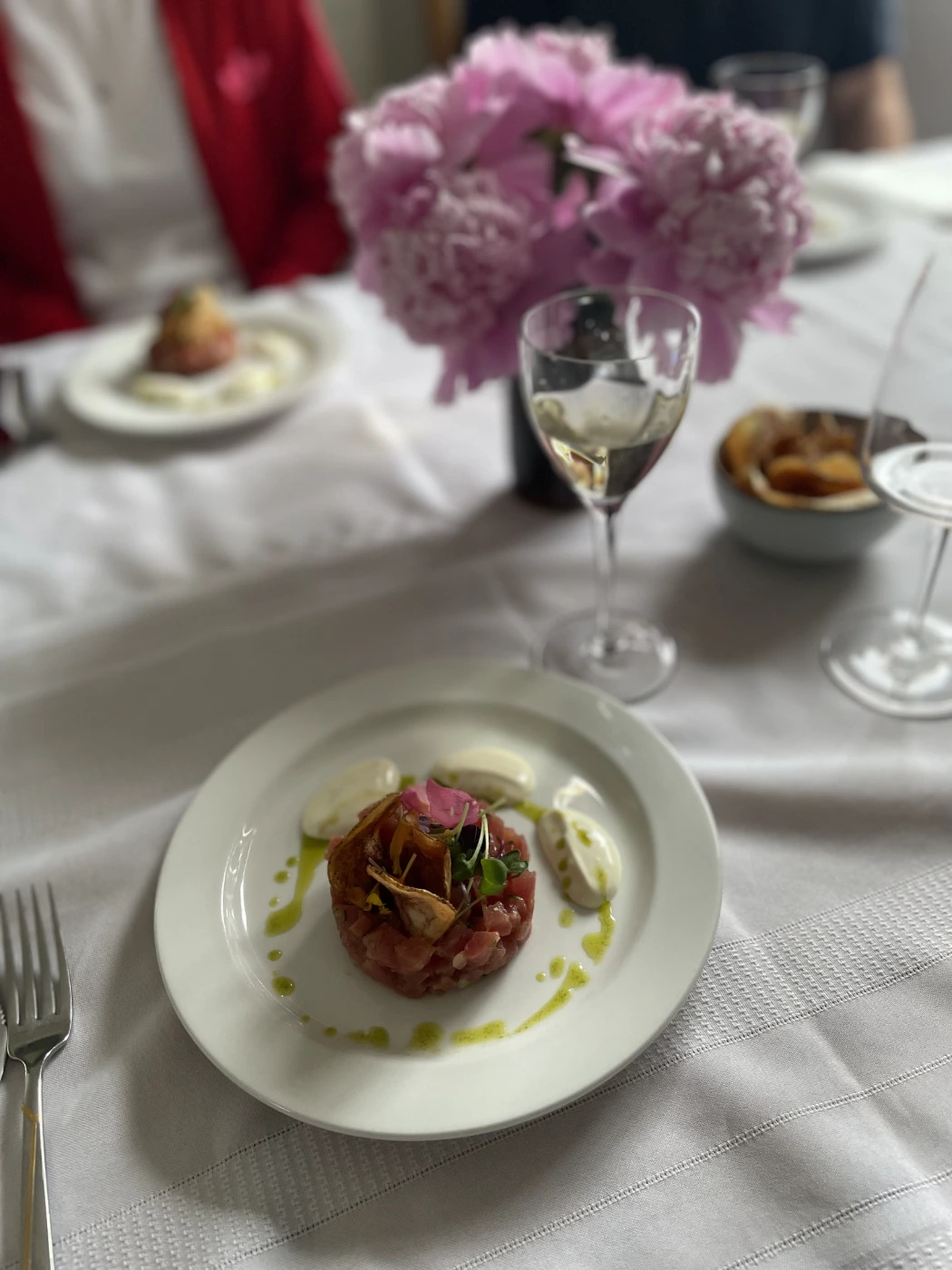 Tuna Tartare plated at table.jpg