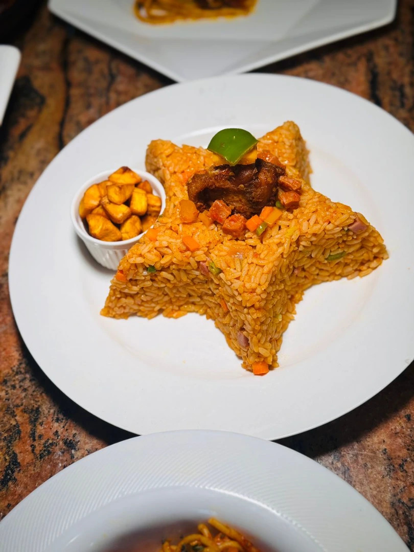 Jollof rice, plantain and fried protein of choice