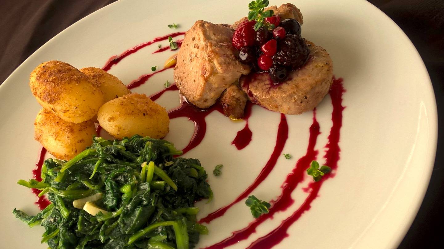 Pork loin medallion with a wild berries reduction with sauteed turnip greens and potatoes.jpg Pork loin medallion with a wild berries reduction with sauteed turnip greens and potatoes.jpg