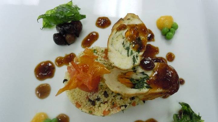 corn feed chicken breast stuf with feta cheese and vegetables serve with apricot and olives couscous, crisp basil and orange sauce.jpg