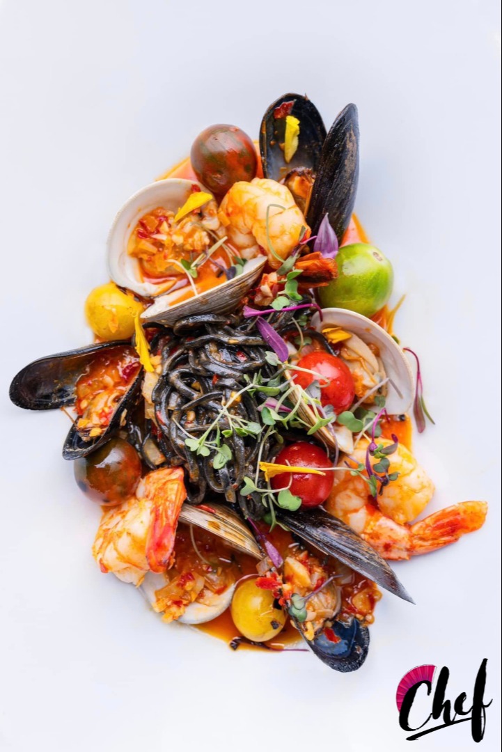 Frutti di Mare Gulf Prawn, clams, mussels, cherry tomatoes, fennel, shallots, Calabrian chilies, butter, squid ink spaghetti a la chittarra  2.PNG