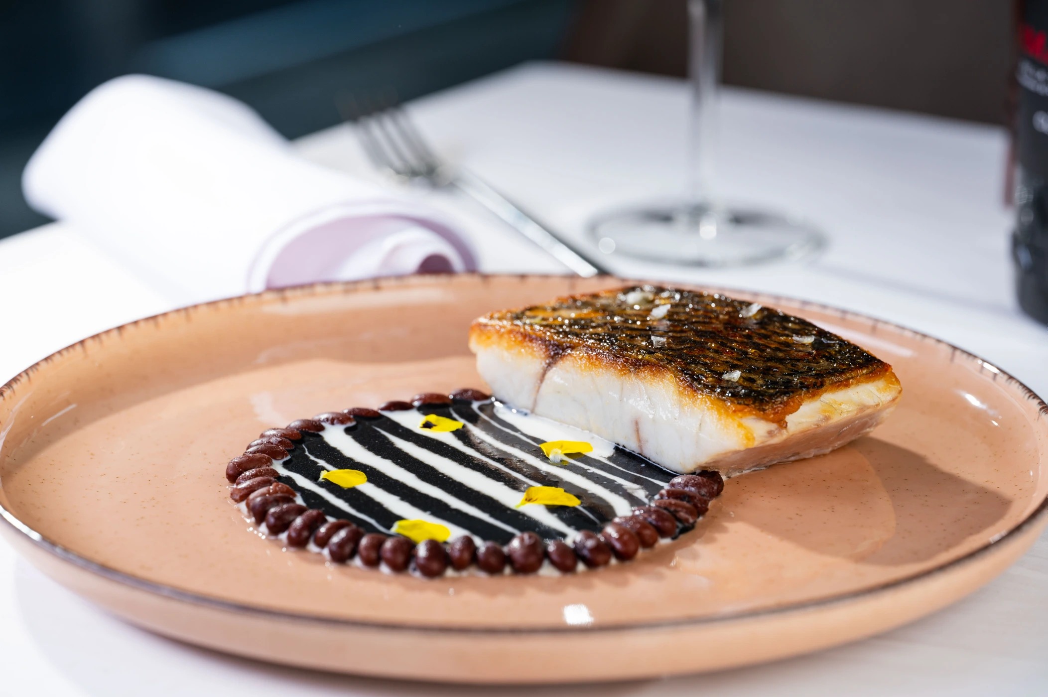 Roasted umbrine, white beans cream, squid ink sauce and flowers 2.JPG