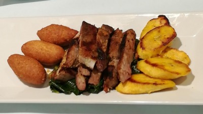 Jamaican jerk pork festivals fried plaintain calaloo