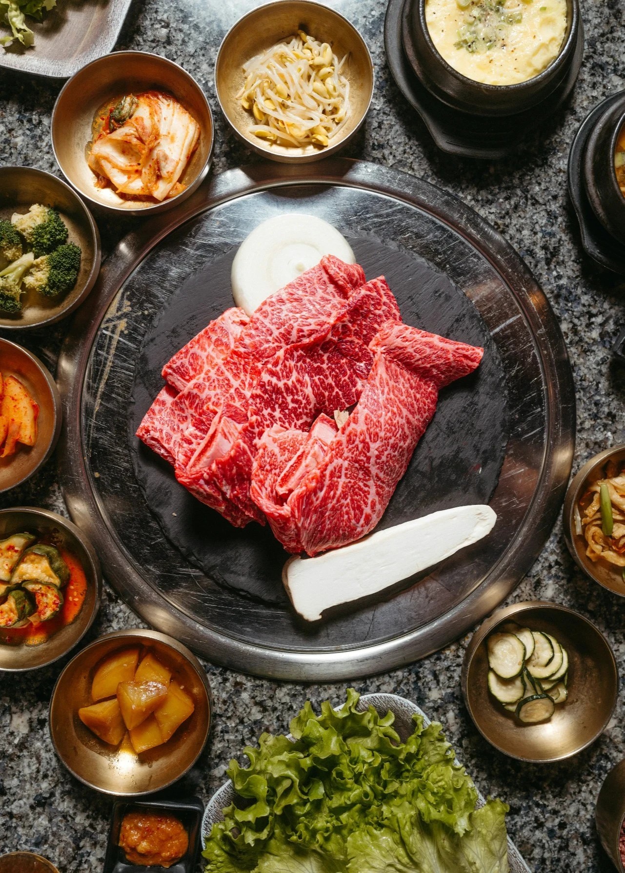 Lamb shanks served and garnished on a white plate