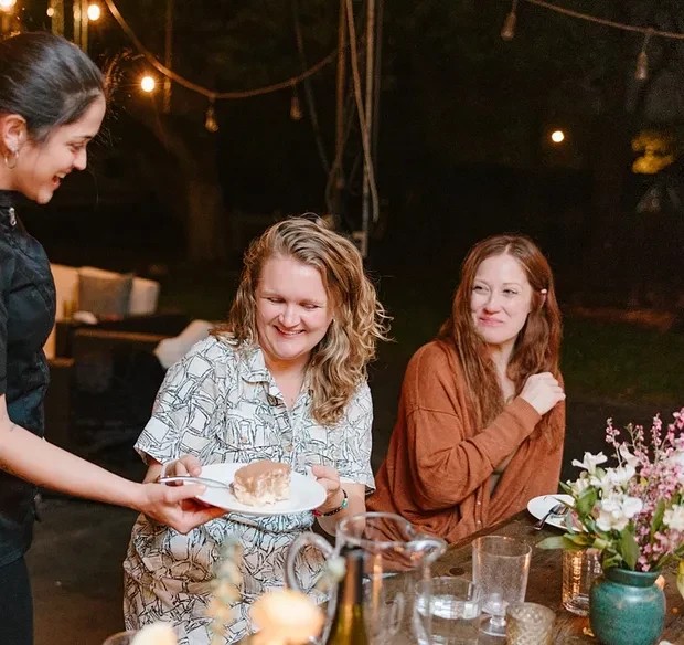 An elegant sushi dinner served with saucers and a teapot