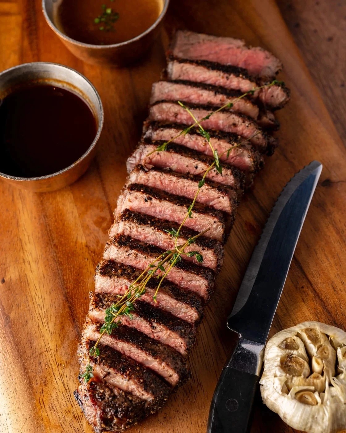 A plate of hibachi vegetables and beef decorated with velvety flowers