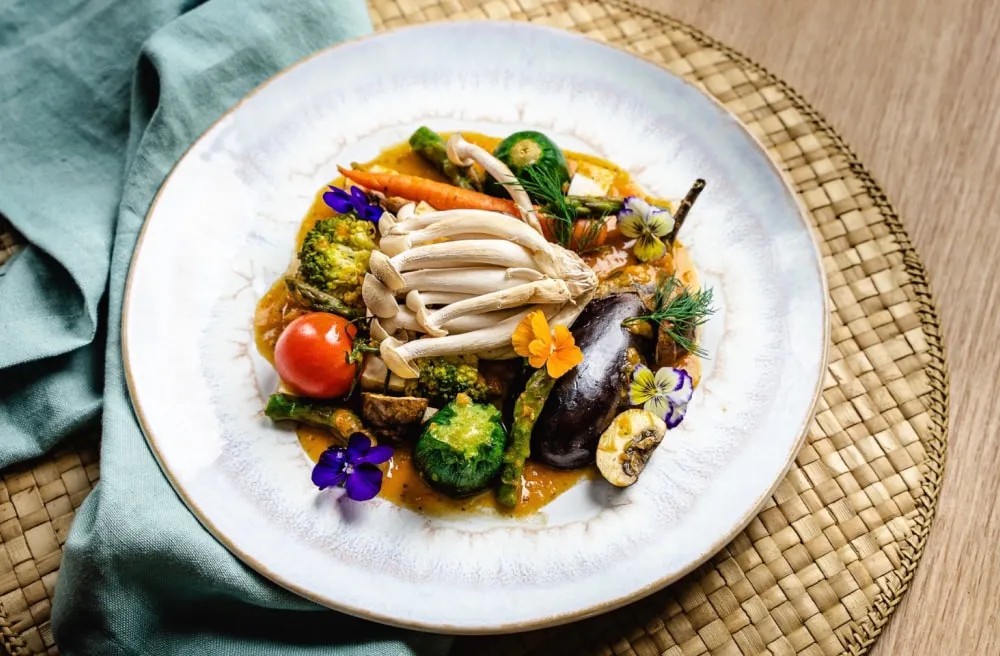 Array of grilled hibachi vegetables served with homemade vinaigrette and topped with fresh mushrooms