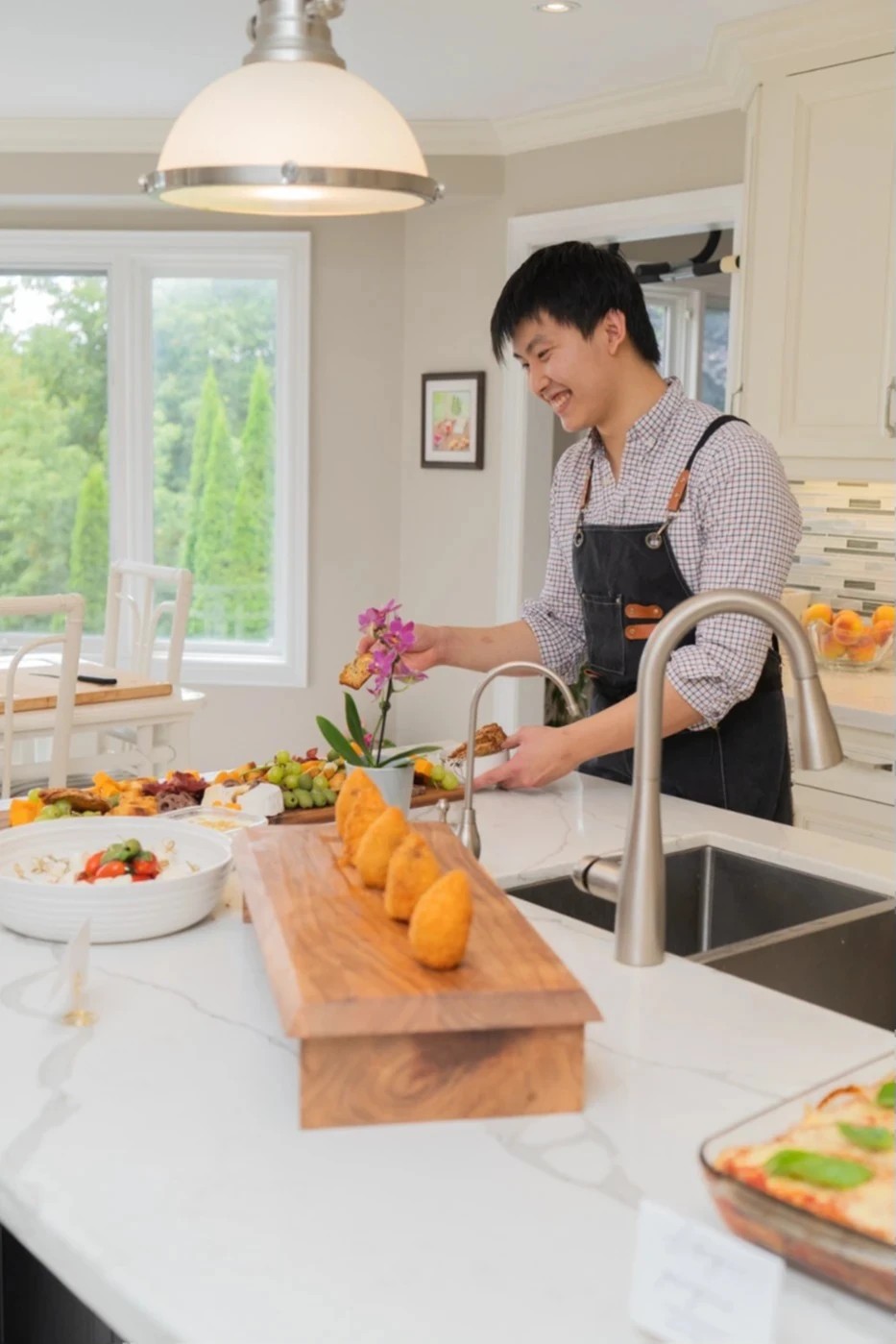 A professional Japanese kitchen on its box next to a rustic cutting board with a fresh slice of tuna