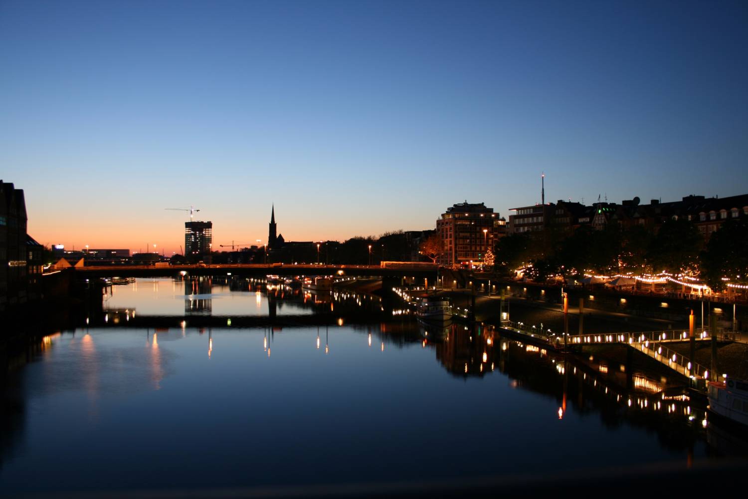 City lights reflecting upon a river in Bremen Private Chef in Bremen header