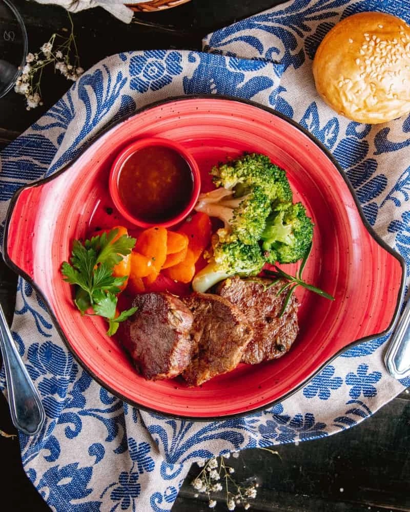 Grilled Wagyu beef served with dipping sauce and seasonal vegetables